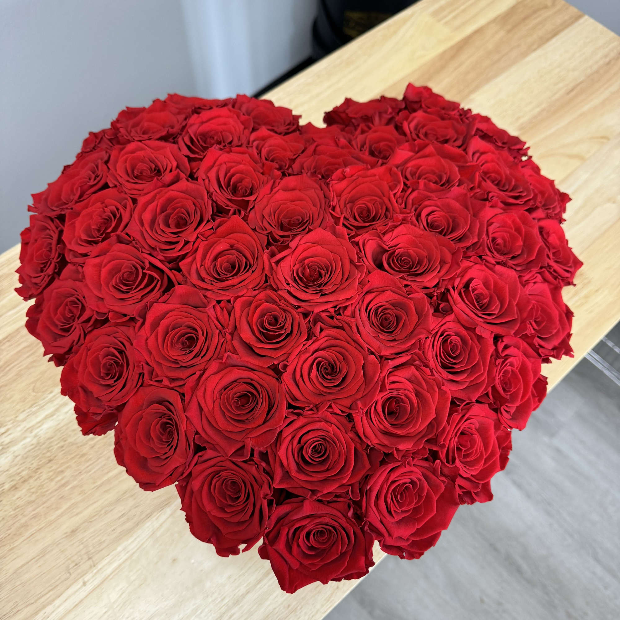 Heart-shaped box with 50 Everlasting Roses